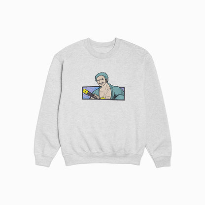 Gray sweatshirt with a graphic of a character holding a gun on a white background